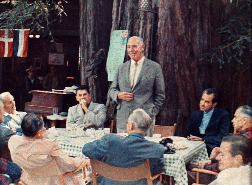Successful professionals networking in an exclusive elite gathering environment resembling the bohemian grove