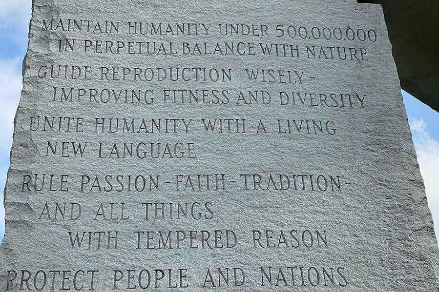 Detailed view of the ancient cuneiform and hieroglyphic carvings on the Georgia Guidestones monument