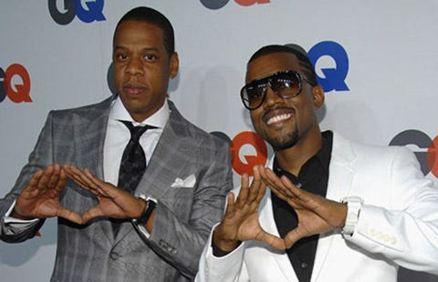 Business professional performing subtle illuminati hand signs for success.