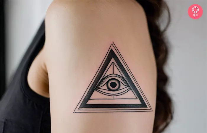 Minimalist illuminati tattoo design featuring pyramid artwork and eye
