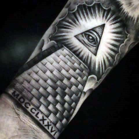 Black and grey illuminati eye tattoo meaning power and spiritual insight on forearm